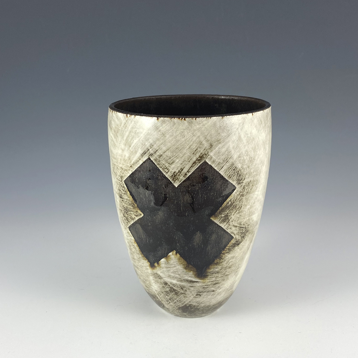 Black cross vase with porcelain