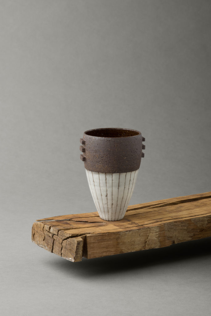 ania perkowska ceramics - black vessel with porcelain