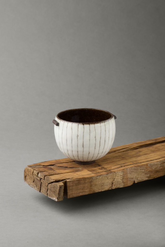 ania perkowska ceramics - black vessel with porcelain