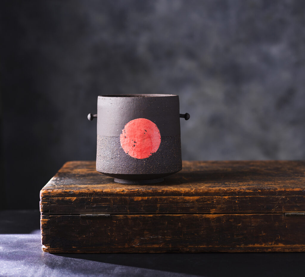 Industrial inspired black vessel by Ania Perkowska Ceramics. Contemporary pottery made in London